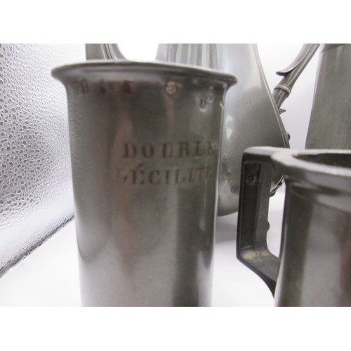 25 - A heavy set of 7 French graduated pewter measures of some age, marked for Litre down to centilitre, ... 