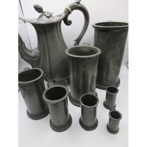 25 - A heavy set of 7 French graduated pewter measures of some age, marked for Litre down to centilitre, ... 