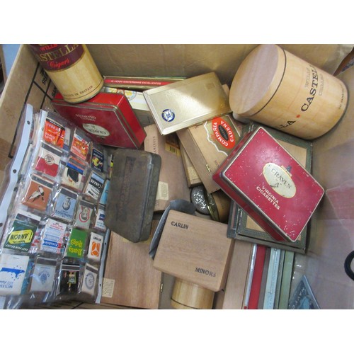 180 - A large box containing cigar boxes, tobacco tins, a collection of match books, a Player's Please ash... 