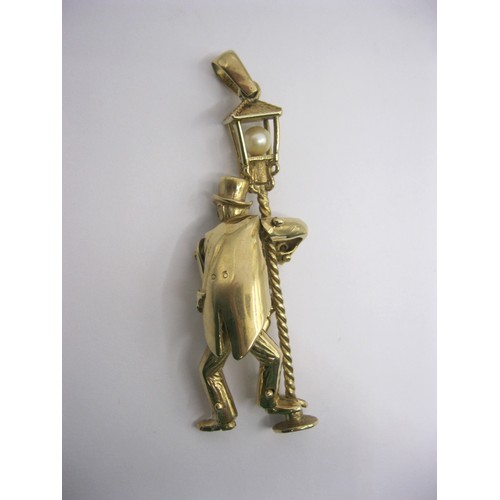 4 - A large 9 carat gold pendant modelled as an articulated drunken man figure supporting himself on a l... 