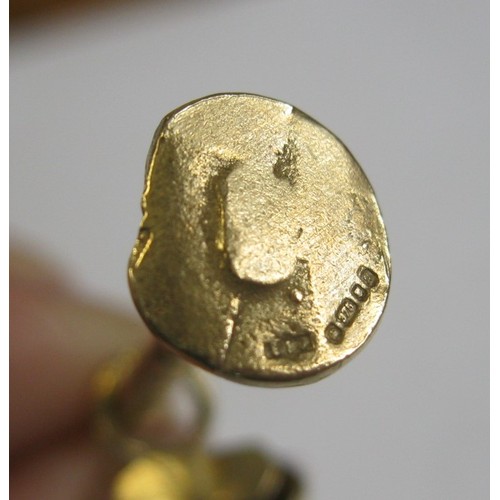 4 - A large 9 carat gold pendant modelled as an articulated drunken man figure supporting himself on a l... 