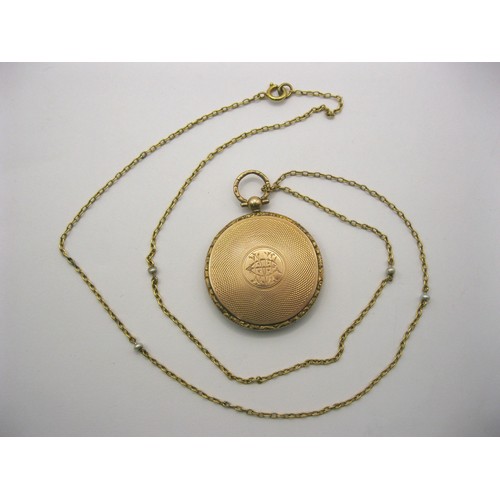 6 - A 9 carat gold circular locket pendant on chain. The locket with British hallmarks within, gross wei... 