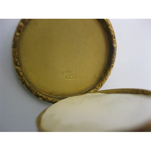 6 - A 9 carat gold circular locket pendant on chain. The locket with British hallmarks within, gross wei... 