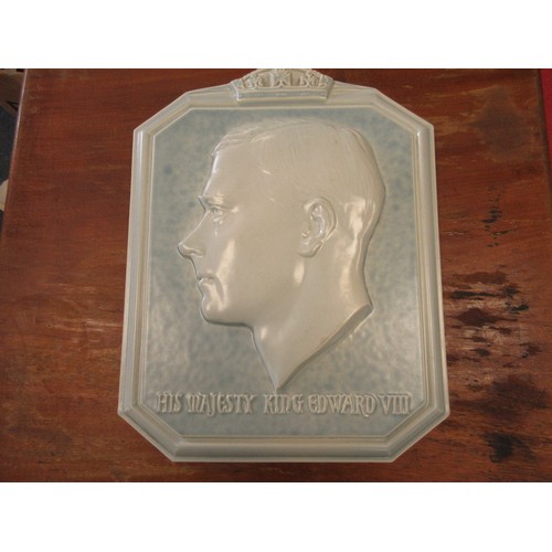 18 - A Poole pottery wall plaque by Harold Brownsword (signed to reverse), depicting a relief cast bust o... 