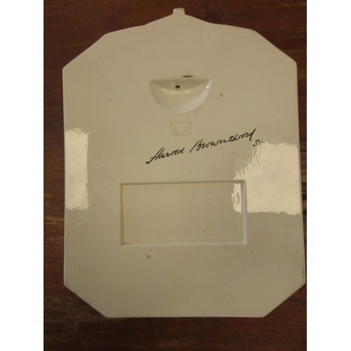 18 - A Poole pottery wall plaque by Harold Brownsword (signed to reverse), depicting a relief cast bust o... 