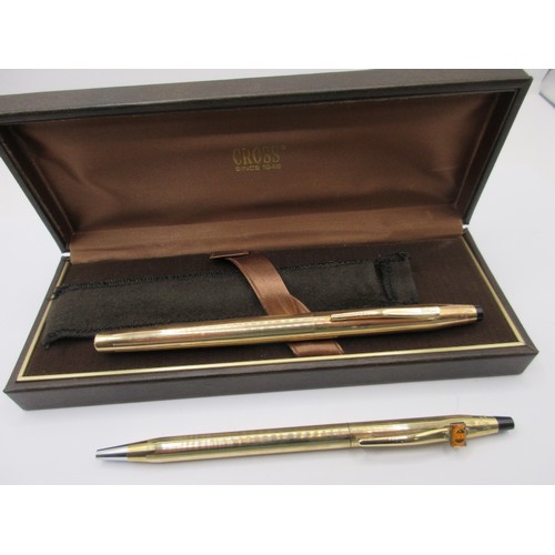 21 - A Cross ballpoint pen with applied corporate branding, and a Cross fountain pen, with a slight a/f C... 