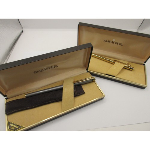 23 - A Sheaffer fountain pen and ballpoint pen.  (1) A Sheaffer white dot fountain pen with graphite styl... 