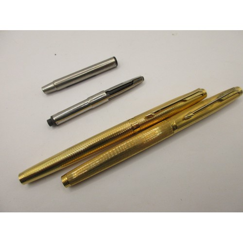 27 - Two gold-plated Parker fountain pens, one with corporate engraving.  (1) Barrel marked PARKER FRANCE... 