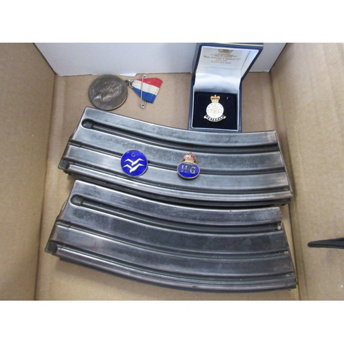 41 - A selection of military items including a pair of SA-80 magazines, a WW2 Home Guard enamel button ba... 