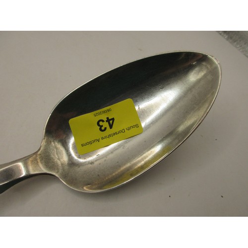 43 - A sterling silver serving spoon in good order, initialled to the handle 'JW' in script, hallmarked f... 