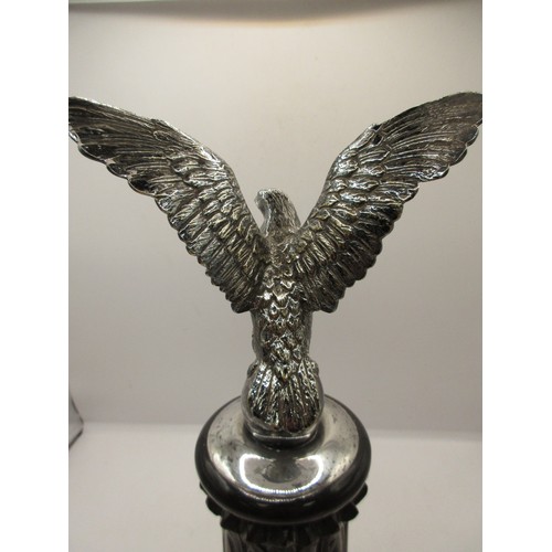 48 - AN imposing antique car bonnet mascot in the form of an eagle with wings spread atop an egg, in silv... 