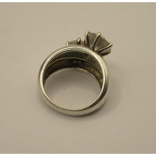 90 - A 925 silver dress ring set with two white stones, ring size N/O, stamped 925 DOCZ, with a black pre... 