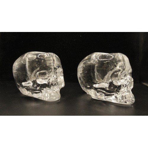 119 - Two Kosta Boda skull tea light holders designed by Ludvig Lofgren, with original boxes and leaflets