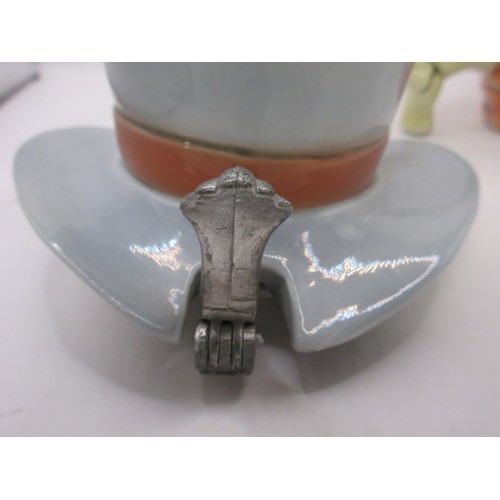 120 - Two German pottery skull tankards or beer steins. One with a serpent handle, the other with a top ha... 