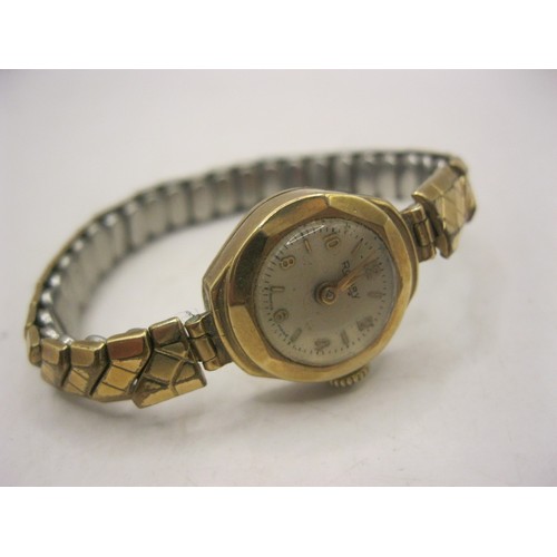 5 - A vintage ladies Rotary wrist watch with 9 carat gold case on a rolled gold strap, case back weighs ... 