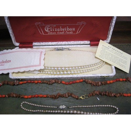 49 - A pair of vintage synthetic pearl necklaces, one boxed, plus a long vintage necklace which looks lik... 