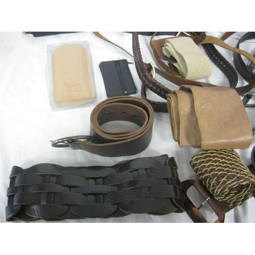 29 - A basket of leather goods including handbags, purses etc