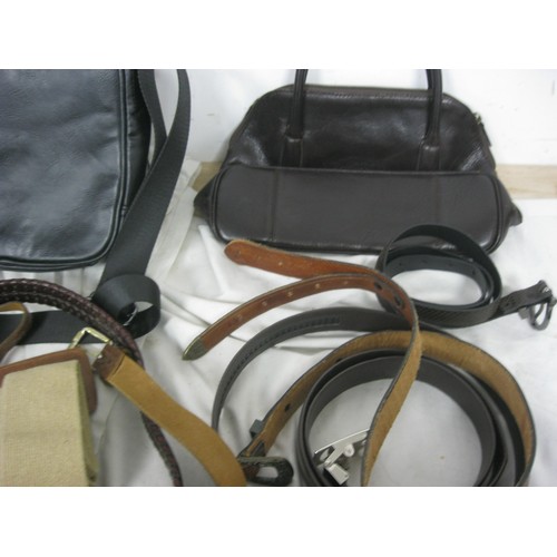 29 - A basket of leather goods including handbags, purses etc