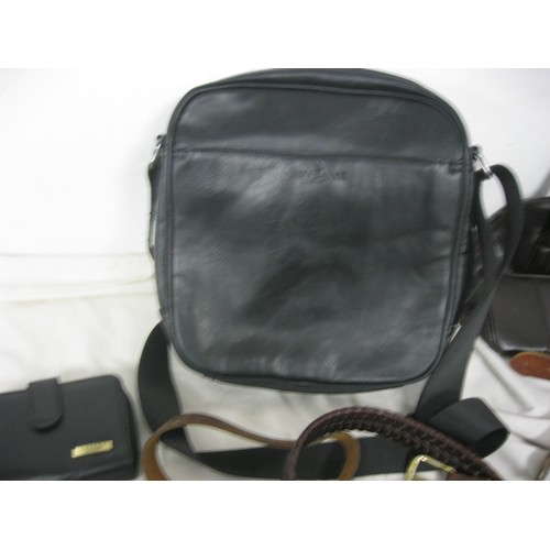 29 - A basket of leather goods including handbags, purses etc