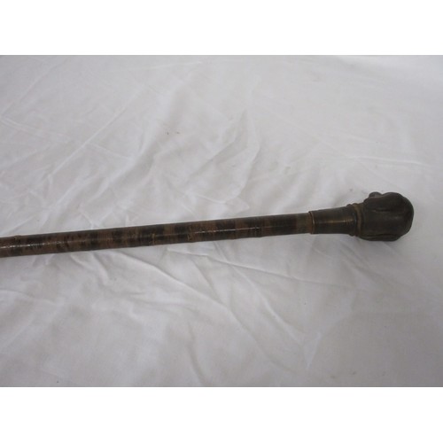 192 - A skull crusher walking cane covered in leather washers, with heavy cast iron dog head handle. Overa... 