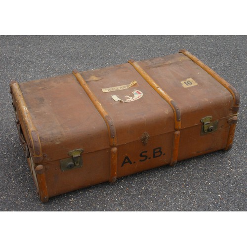 207 - A large antique trunk with wooden binding to exterior