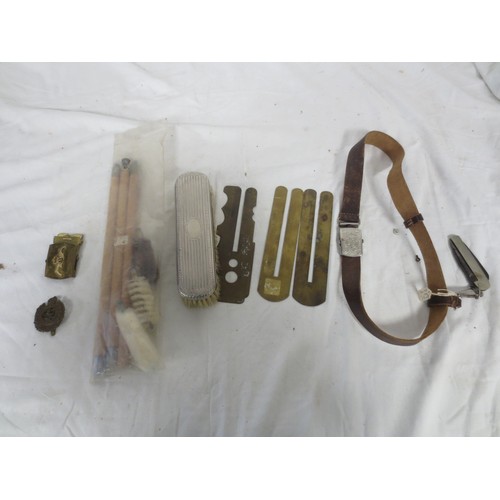 215 - An RN Submarines belt buckle, several pre-WW2 button slides, a Royal Engineers cap badge, a white me... 