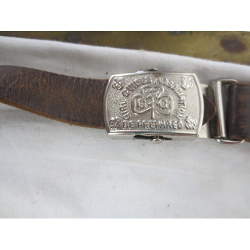 215 - An RN Submarines belt buckle, several pre-WW2 button slides, a Royal Engineers cap badge, a white me... 