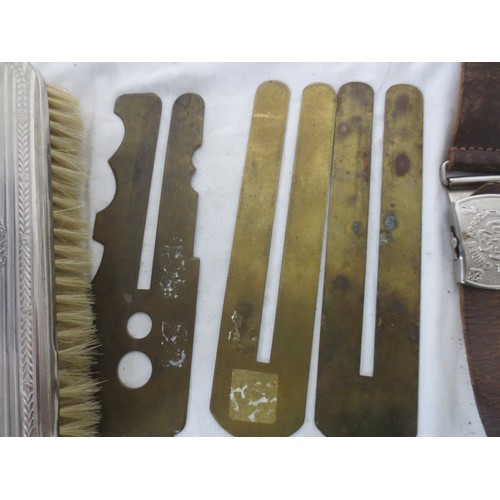 215 - An RN Submarines belt buckle, several pre-WW2 button slides, a Royal Engineers cap badge, a white me... 