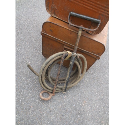 217 - A vintage Merryweather stirrup pump with hose and webbing hose retainer, believed to be WW2-era ARP