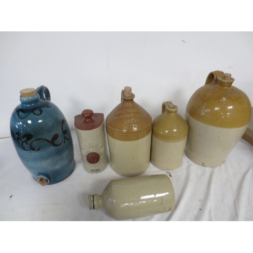 182 - A selection of earthenware flagons and bed warmers, one of the flagons by Doulton London and featuri... 