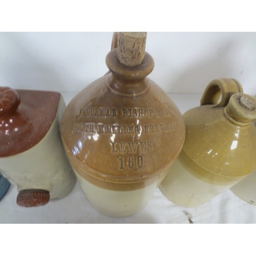 182 - A selection of earthenware flagons and bed warmers, one of the flagons by Doulton London and featuri... 