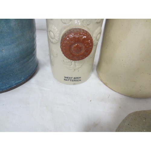 182 - A selection of earthenware flagons and bed warmers, one of the flagons by Doulton London and featuri... 