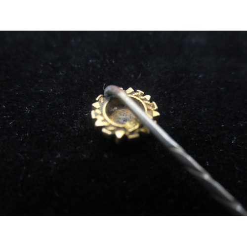 215 - A gentleman's tie pin, base metal shaft, round gold stud with central clear stone (does not test as ... 