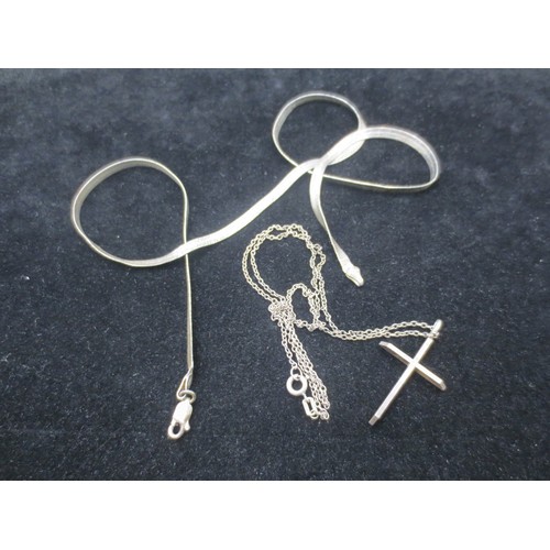 216 - A sterling silver ribbon necklace and a white metal crucifix on a sterling silver chain, total weigh... 