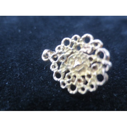 219 - A yellow metal (acid tests as 9 carat) pendant with a single pearl or simulated pearl mounted to cen... 