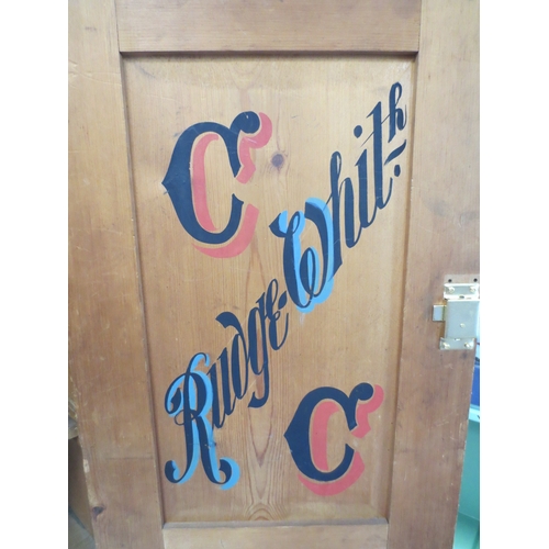 229 - A pine trophy cabinet, the interior with a mount for a trophy and the inside of the door painted for... 