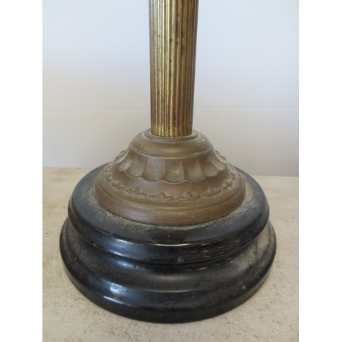 237 - A Corinithian columnal oil lamp with art nouveau floral decorated oil reservoir, with funnel and etc... 