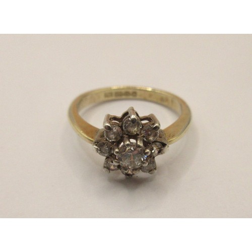 51 - A 925 silver gilt ring with a daisy setting of nine white stones, stamped 925 import marks.