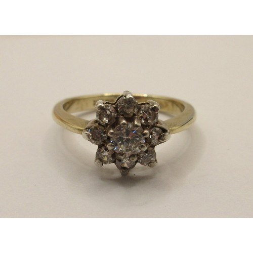 51 - A 925 silver gilt ring with a daisy setting of nine white stones, stamped 925 import marks.