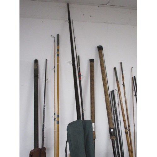 54 - A fishing rod bag containing nine rods and other items, a chair bag with folding seat and backpack s... 