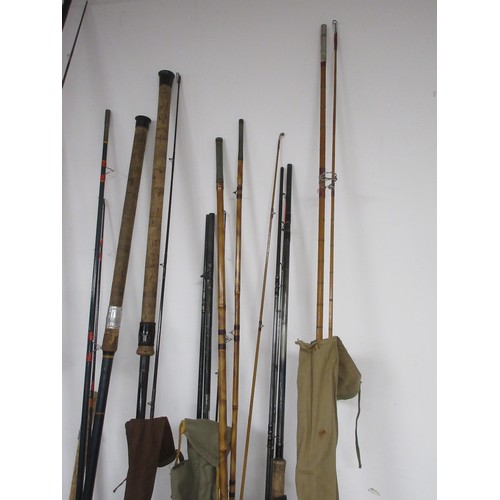 54 - A fishing rod bag containing nine rods and other items, a chair bag with folding seat and backpack s... 