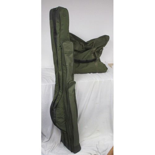 54 - A fishing rod bag containing nine rods and other items, a chair bag with folding seat and backpack s... 