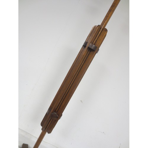 59 - An oak art deco style standard lamp with an interesting finned design