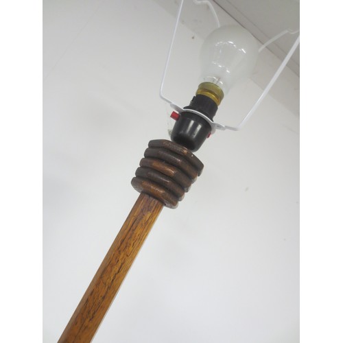 59 - An oak art deco style standard lamp with an interesting finned design