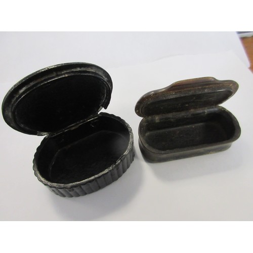 23 - A pair of antique snuff boxes: one carved in horn with patterned white metal inlay ring to lid, the ... 