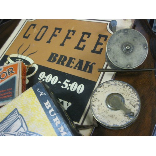 53 - A mixed lot comprising a small brass fishing reel, an extending 24' cloth tape measure in a brass ho... 