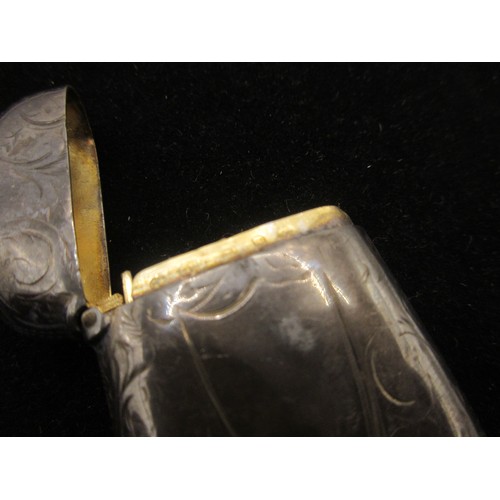 39 - A silver vesta with foliate engraving and vacant escutcheon to one side, gilt interior, marks for Bi... 