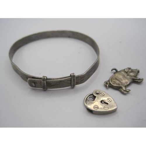 42 - A white metal Christening bracelet stamped silver (a/f dents), a hallmarked silver heart-shaped padl... 