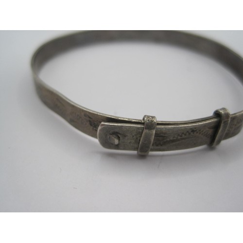 42 - A white metal Christening bracelet stamped silver (a/f dents), a hallmarked silver heart-shaped padl... 