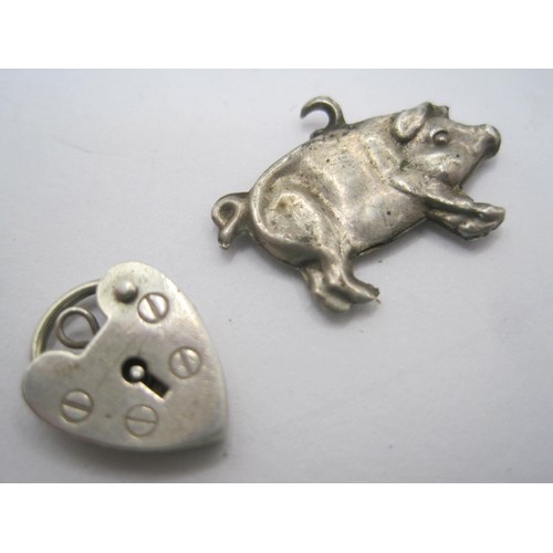 42 - A white metal Christening bracelet stamped silver (a/f dents), a hallmarked silver heart-shaped padl... 